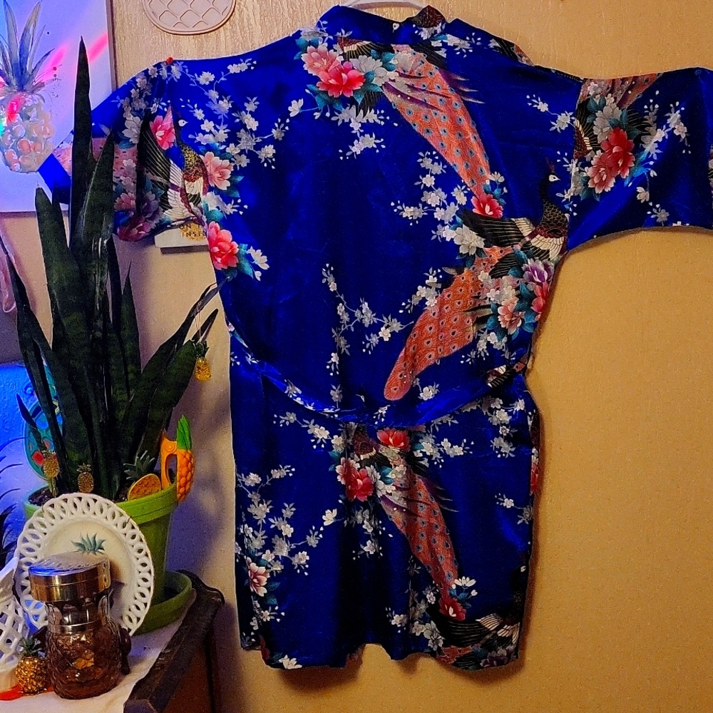 Soft, short and beautifully decorated and colored bathrobe